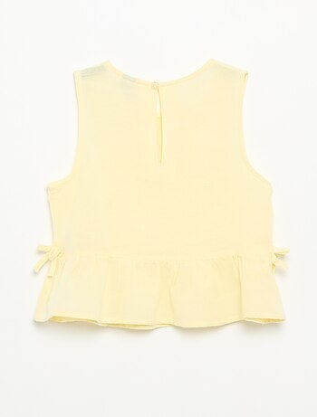 Blusa peplum con lazos fantasía
