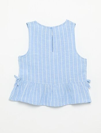 Blusa peplum con lazos fantasía