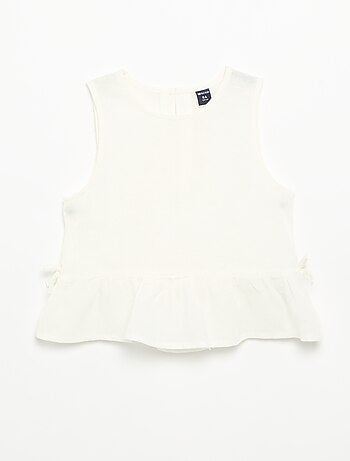 Blusa peplum con lazos fantasía