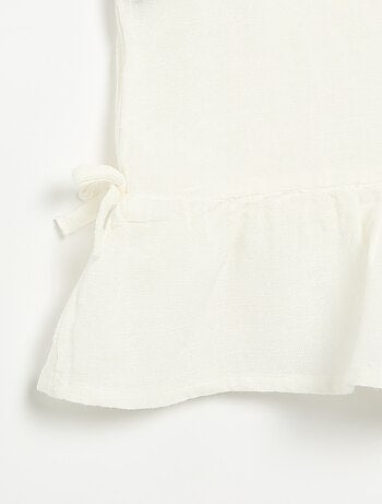 Blusa peplum con lazos fantasía