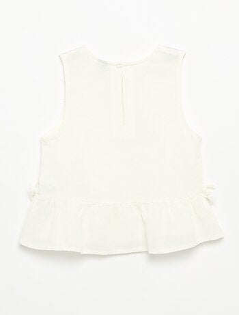 Blusa peplum con lazos fantasía