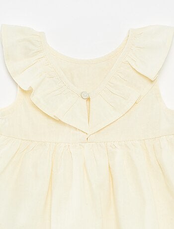 Blusa sin mangas con plastrón con volante