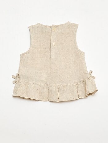 Blusa sin mangas con volantes y lazos