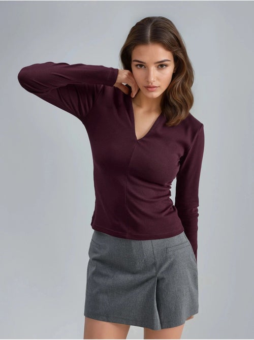 Blusa slim fit de manga larga con cuello en v busem - Kiabi Blusa slim fit de manga larga con cuello en v busem - Kiabi