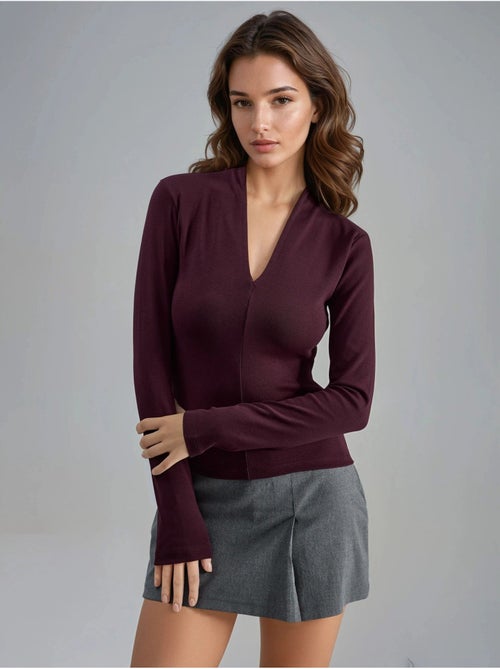 Blusa slim fit de manga larga con cuello en v busem - Kiabi Blusa slim fit de manga larga con cuello en v busem - Kiabi