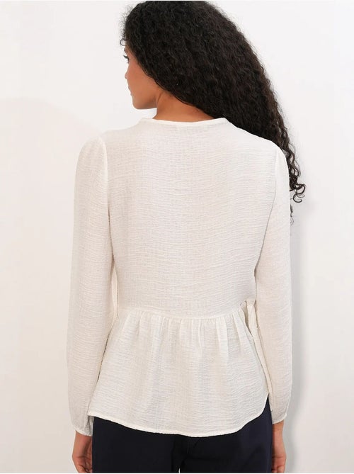 Blusa tejida con volantes y cierre de lazada bdart - Kiabi Blusa tejida con volantes y cierre de lazada bdart - Kiabi