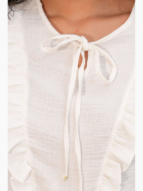 Blusa tejida con volantes y cierre de lazada bdart - Kiabi Blusa tejida con volantes y cierre de lazada bdart - Kiabi