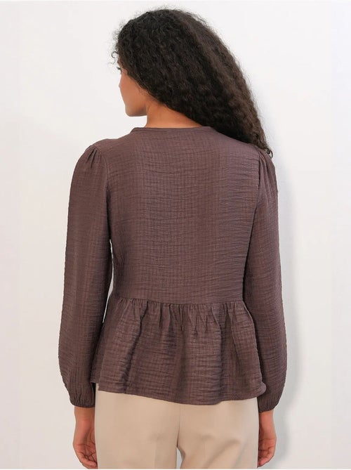 Blusa tejida con volantes y cierre de lazada bdart - Kiabi Blusa tejida con volantes y cierre de lazada bdart - Kiabi