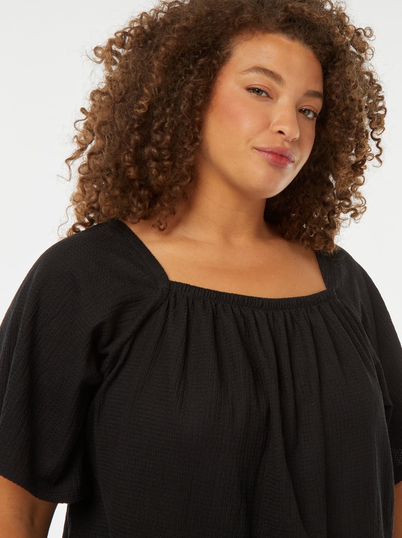 Blusa vaporosa de punto gofrado con cuello bardot negro - Kiabi