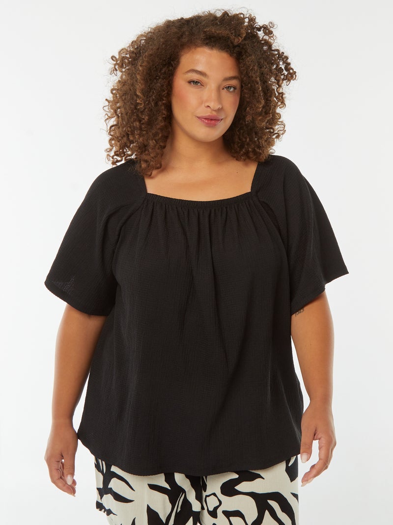 Blusa vaporosa de punto gofrado con cuello bardot negro - Kiabi