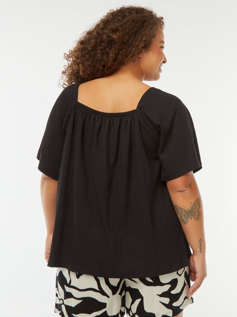 Blusa vaporosa de punto gofrado con cuello bardot negro - Kiabi