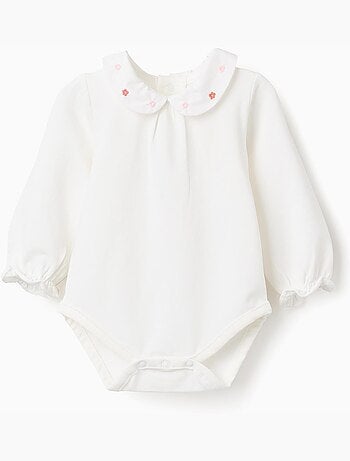 Body de manga larga con flores y volantes