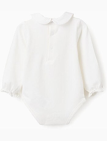 Body de manga larga con flores y volantes