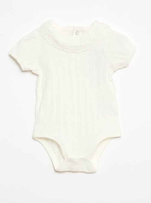 Body de manga larga en punto de canalé con cuello fantasía - Kiabi