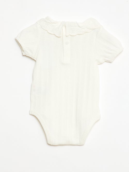 Body de manga larga en punto de canalé con cuello fantasía - Kiabi