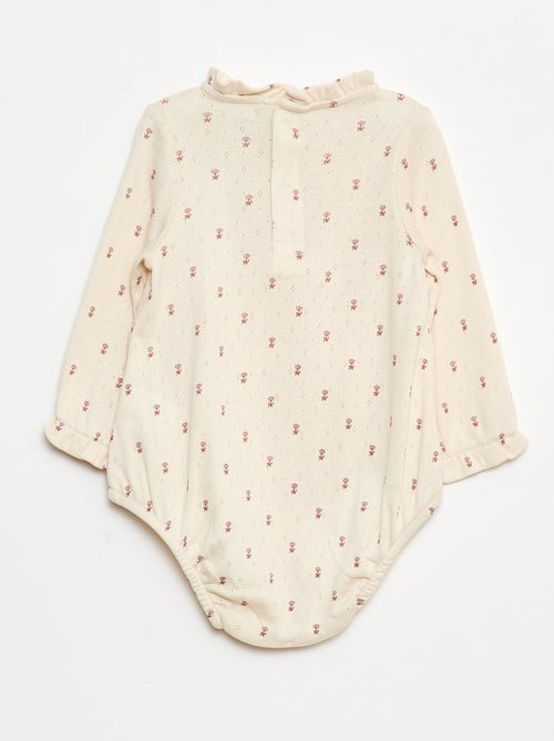 Body de punto plumeti con cuello volante y estampado integral - Kiabi