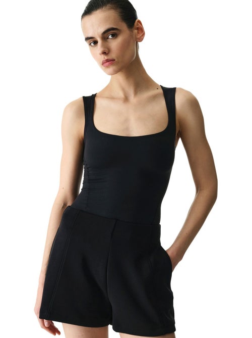 Bodysuit con cuello en u y textura suave penti - Kiabi Bodysuit con cuello en u y textura suave penti - Kiabi