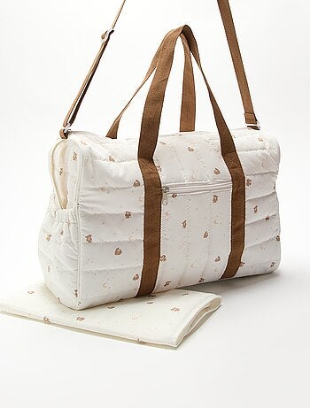 Bolso cambiador con cambiador interior y enganche para carrito.