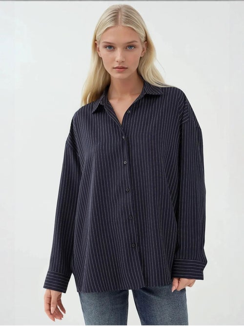 Camisa a rayas con botones y cuello camisero hiccup - Kiabi Camisa a rayas con botones y cuello camisero hiccup - Kiabi