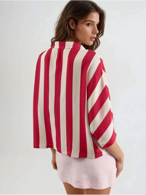 Camisa a rayas de corte relajado con botones busem - Kiabi Camisa a rayas de corte relajado con botones busem - Kiabi