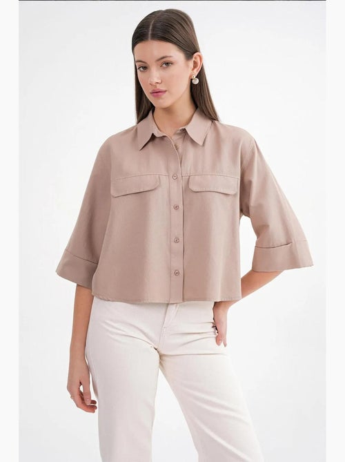 Camisa corta holgada con cierre de botones y bolsillo mixray - Kiabi Camisa corta holgada con cierre de botones y bolsillo mixray - Kiabi