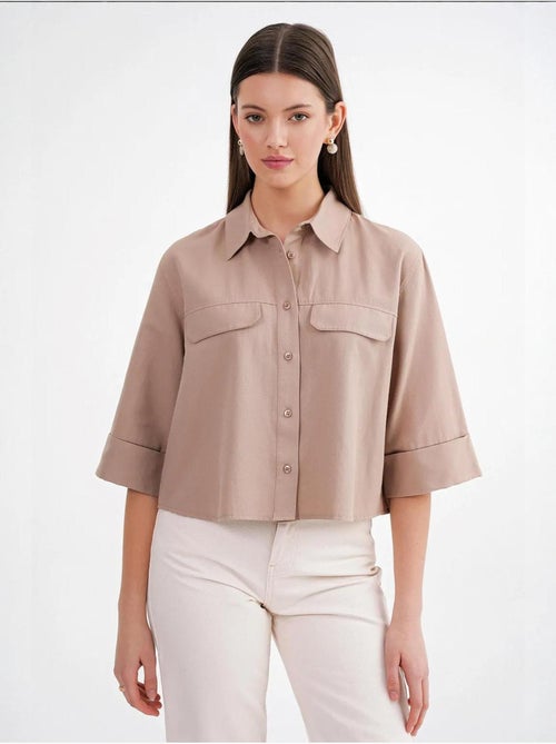 Camisa corta holgada con cierre de botones y bolsillo mixray - Kiabi Camisa corta holgada con cierre de botones y bolsillo mixray - Kiabi