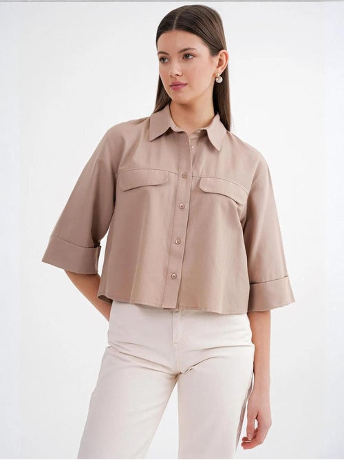 Camisa corta holgada con cierre de botones y bolsillo mixray - Kiabi Camisa corta holgada con cierre de botones y bolsillo mixray - Kiabi