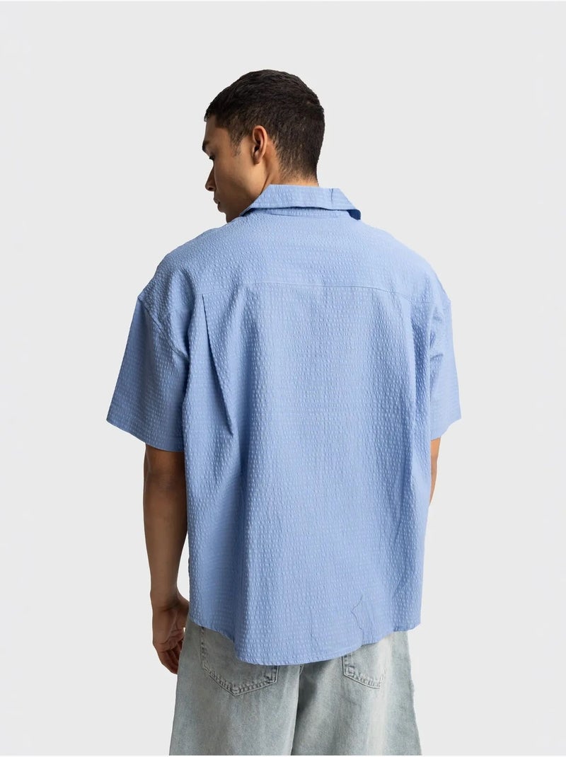 Camisa de algodón texturizado con botones y bolsillo giesto Azul claro - Kiabi