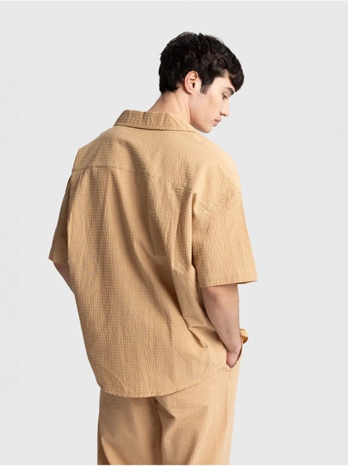 Camisa de algodón texturizado con botones y bolsillo giesto - Kiabi Camisa de algodón texturizado con botones y bolsillo giesto - Kiabi