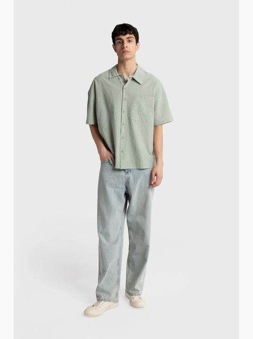 Camisa de algodón texturizado con botones y bolsillo giesto - Kiabi Camisa de algodón texturizado con botones y bolsillo giesto - Kiabi