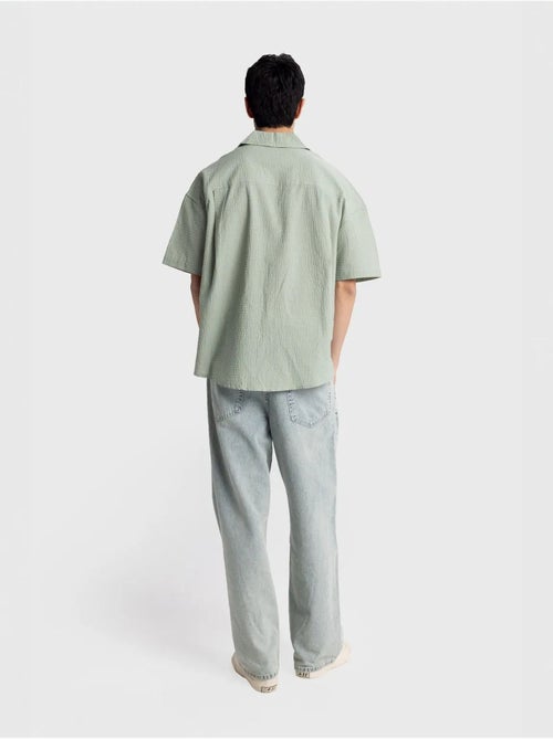 Camisa de algodón texturizado con botones y bolsillo giesto - Kiabi Camisa de algodón texturizado con botones y bolsillo giesto - Kiabi