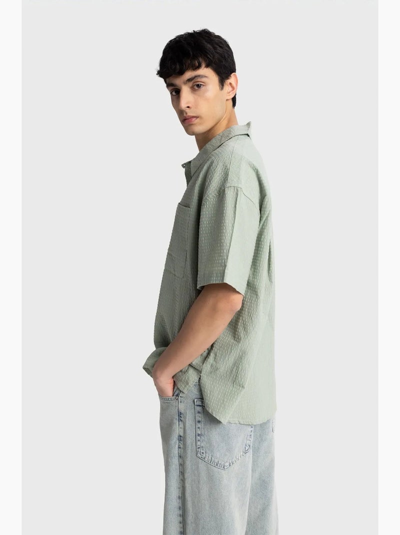 Camisa de algodón texturizado con botones y bolsillo giesto Verde menta - Kiabi
