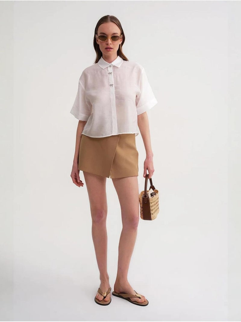 Camisa de manga corta abotonada con accesorio de piedra mixray Marfil - Kiabi