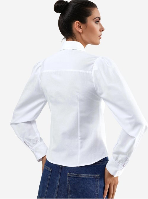 Camisa de popelina lisa con cierre de botones busem - Kiabi Camisa de popelina lisa con cierre de botones busem - Kiabi