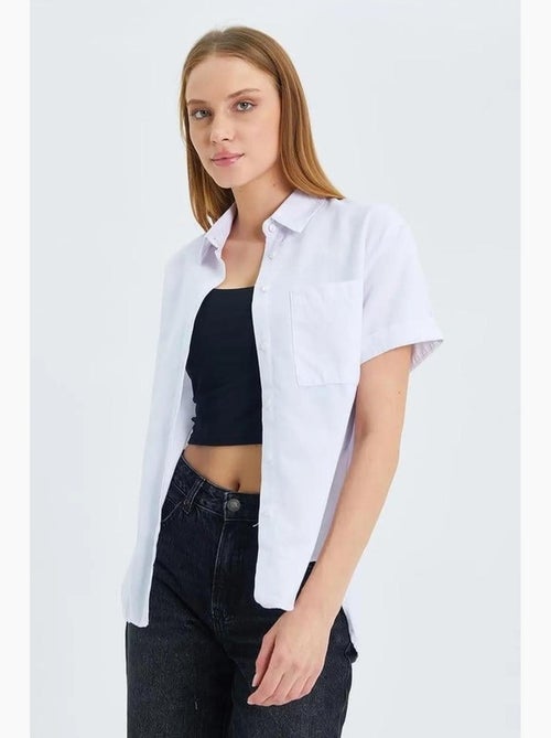 Camisa de popelina slim fit con bolsillo mixray - Kiabi Camisa de popelina slim fit con bolsillo mixray - Kiabi