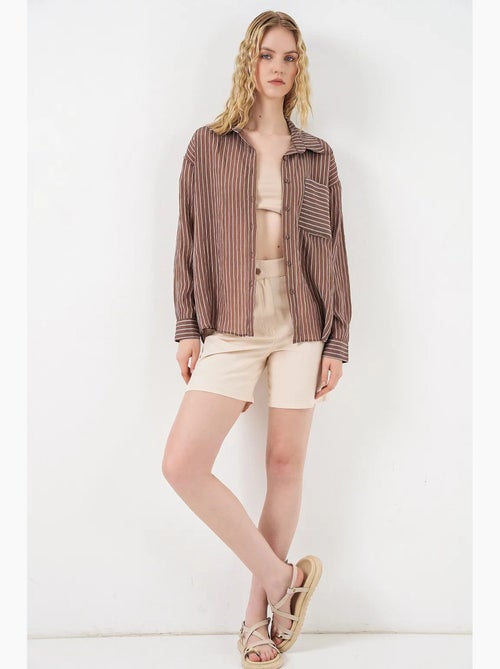 Camisa oversize a rayas con cierre de botones delantero bdart - Kiabi Camisa oversize a rayas con cierre de botones delantero bdart - Kiabi