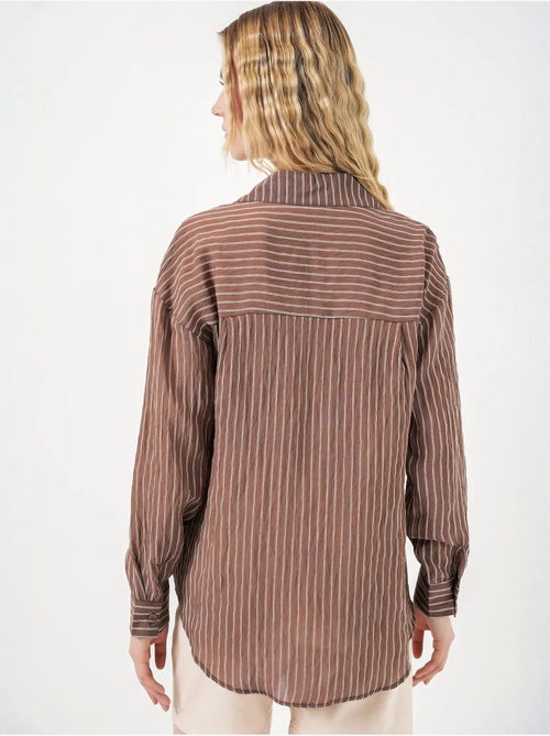 Camisa oversize a rayas con cierre de botones delantero bdart - Kiabi Camisa oversize a rayas con cierre de botones delantero bdart - Kiabi