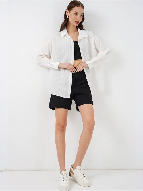 Camisa oversize texturizada de rayas con cierre de botones bdart - Kiabi Camisa oversize texturizada de rayas con cierre de botones bdart - Kiabi