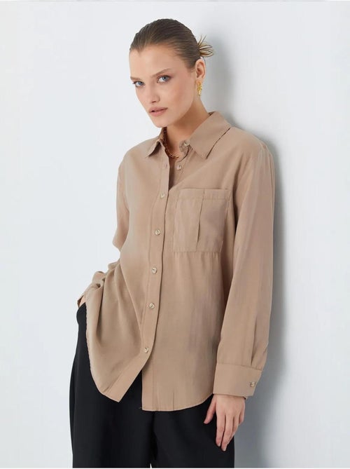 Camisa relajada con botones y bolsillo mixray - Kiabi Camisa relajada con botones y bolsillo mixray - Kiabi