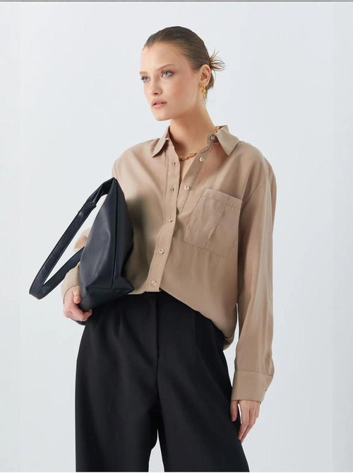 Camisa relajada con botones y bolsillo mixray - Kiabi Camisa relajada con botones y bolsillo mixray - Kiabi