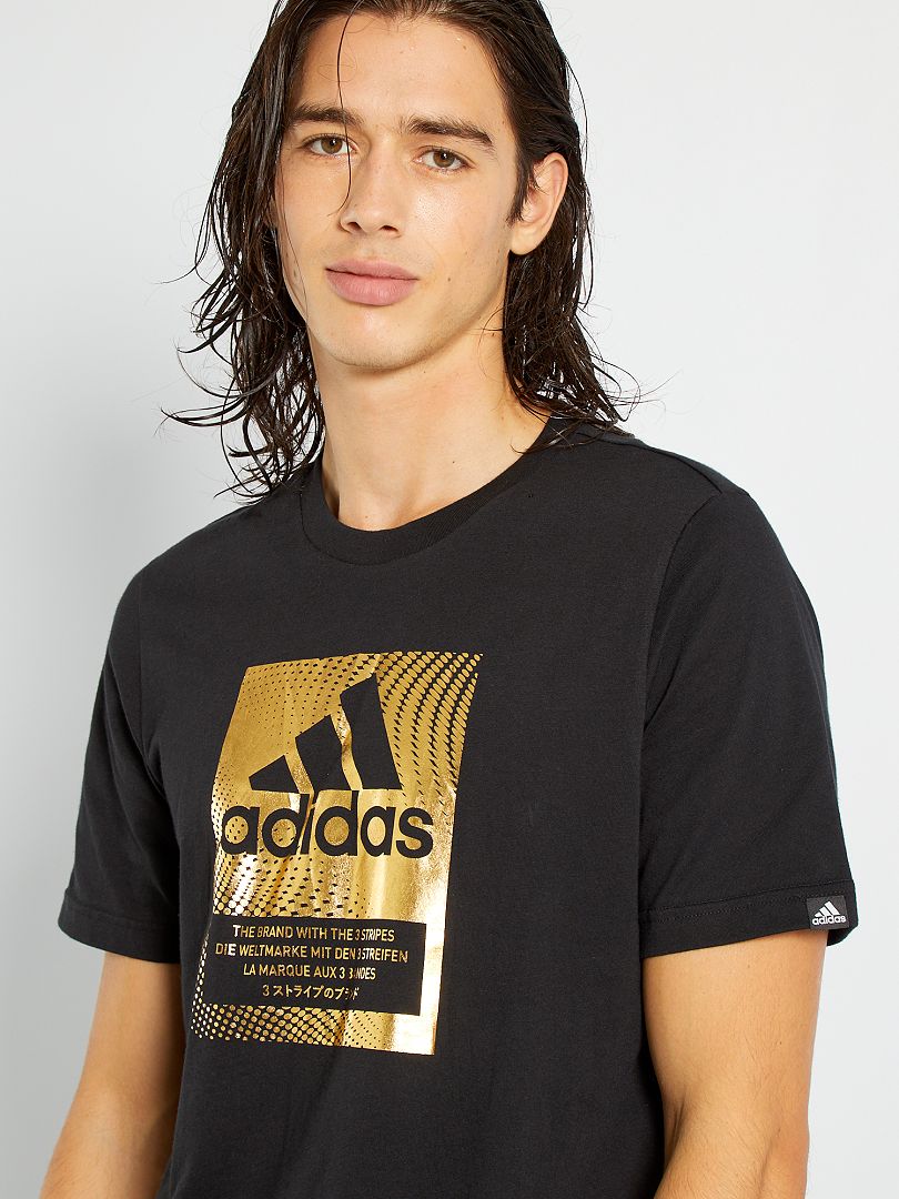 Vista Saturar Clan Camiseta 'Adidas' con logo dorado - NEGRO - Kiabi - 25.00€