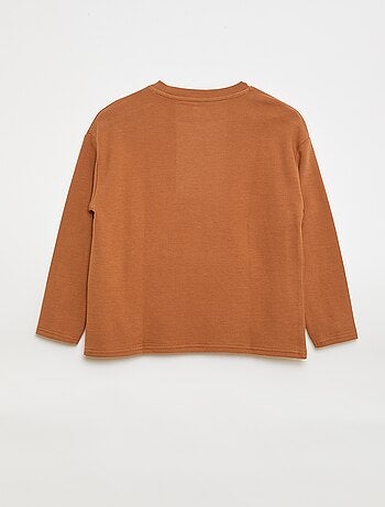 Camiseta con bolsillo canguro en malla otomana