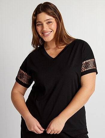 Camiseta para mujer negra manga sisa con estampado metalizado
