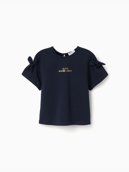 Camiseta con estampado y nudos decorativos - Kiabi Camiseta con estampado y nudos decorativos - Kiabi