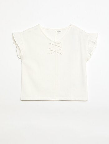 Camiseta con nudos decorativos