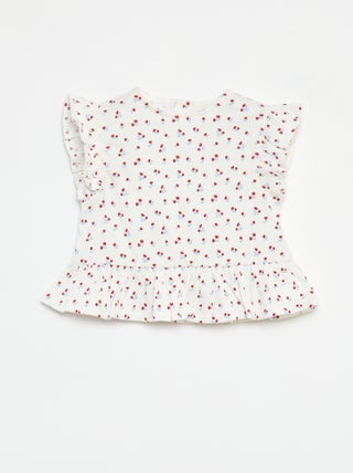 Camiseta con volantes y estampado