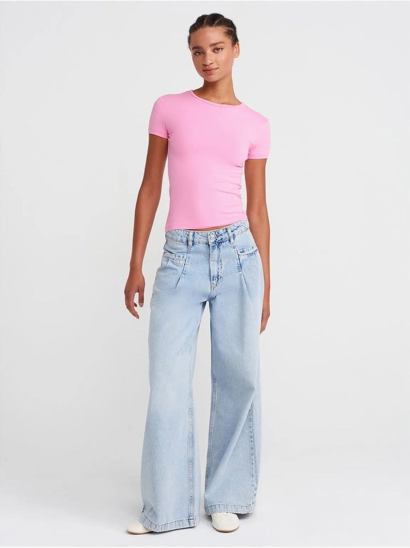 Camiseta crop de mujer slim fit con cuello redondo dilvin Rosa fluo/Solinotes - Kiabi