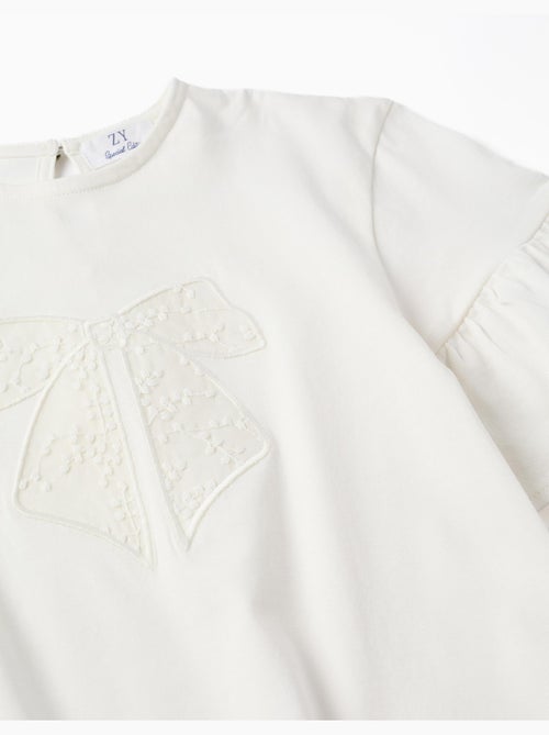 Camiseta de algodón con volantes y lazo bordado - Kiabi Camiseta de algodón con volantes y lazo bordado - Kiabi