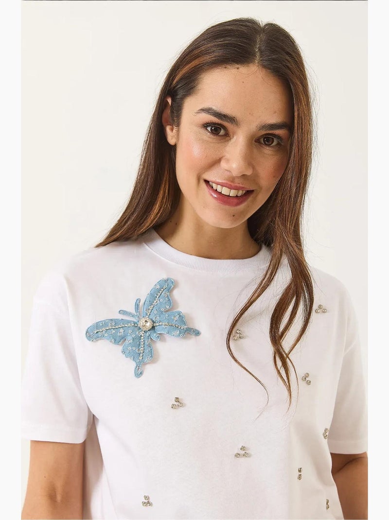 Camiseta de manga corta con accesorios de mariposa y adornos de piedras lucci Blanco - Kiabi