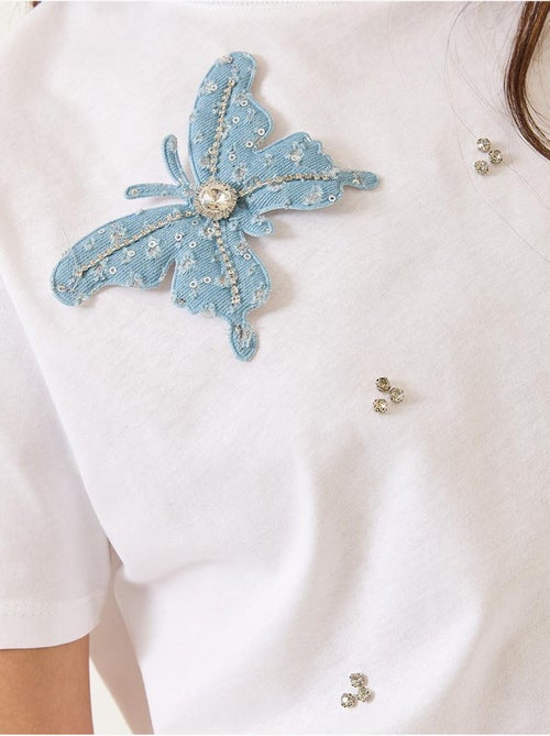 Camiseta de manga corta con accesorios de mariposa y adornos de piedras lucci - Kiabi
